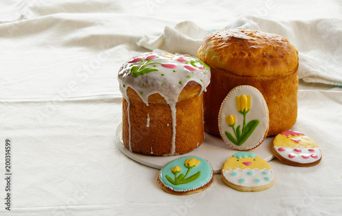 easter cake, kulich with cookies with roal icing photo