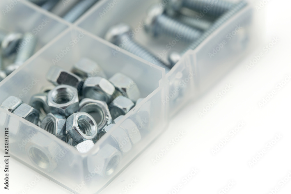 Assorted nuts and bolts closeup in blue tone Assorted nuts and bolts closeup in blue tone