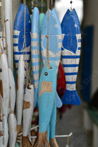Wooden fish sold at the souvenir shop in Milos Island, Greece © akturer
