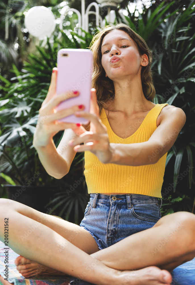 Girl taking a selfie in summertime Girl taking a selfie in summertime