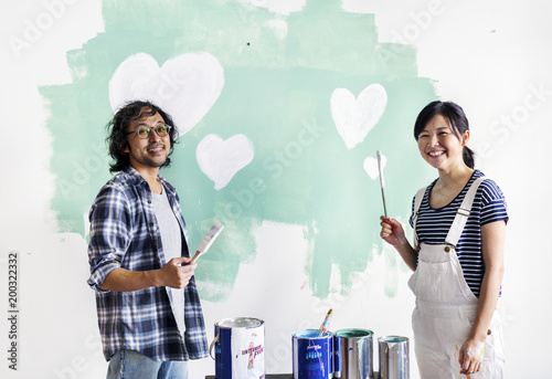 Asian couple renovating the house