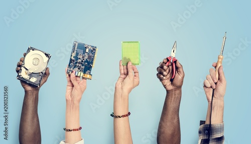 Hands holding digital component isolated on background