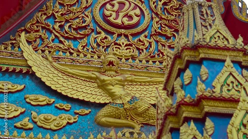 Steadycam shot of a buddhist temple Wat Putta Mongkon, Wat Mongkol Nimit, in Phuket town, Phuket island, Thailand photo