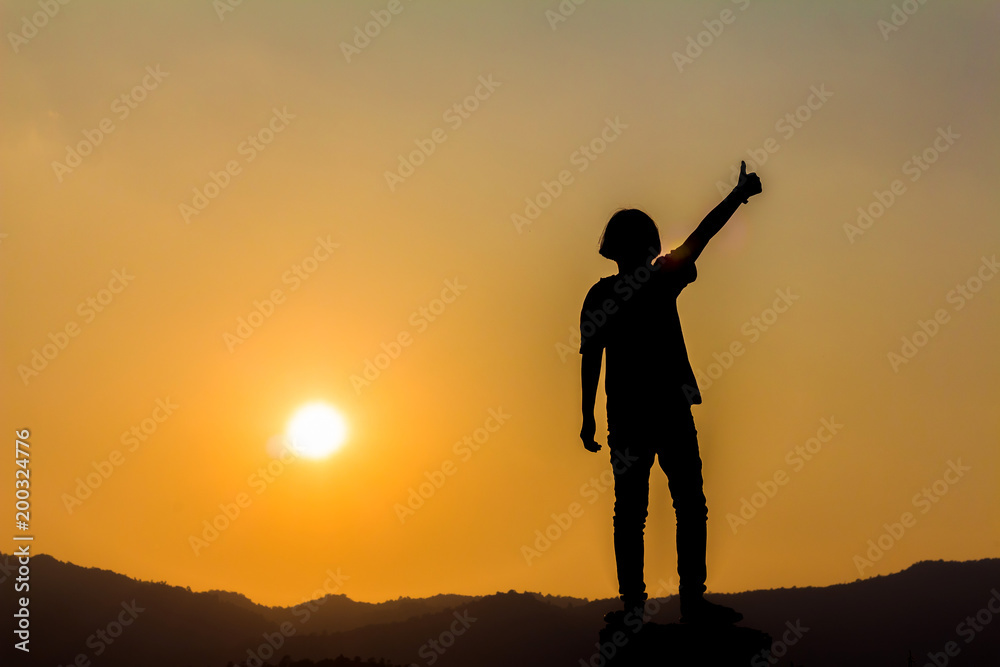 Silhouette small girl playing at sunset background Silhouette small girl playing at sunset background