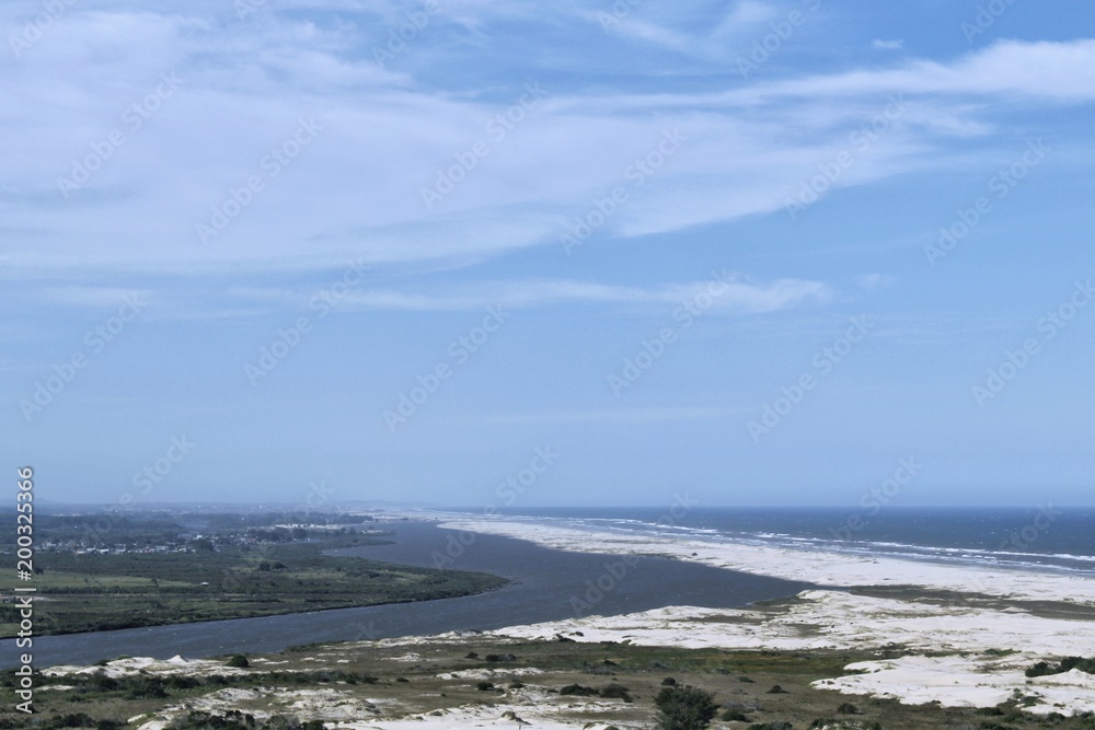 The encounter of the river with the sea in the city of Aranguá in the state of Santa Catarina, Brazil. The place where the photos were taken is called Morro dos Conventos. The encounter of the river with the sea in the city of Aranguá in the state of Santa Catarina, Brazil. The place where the photos were taken is called Morro dos Conventos.