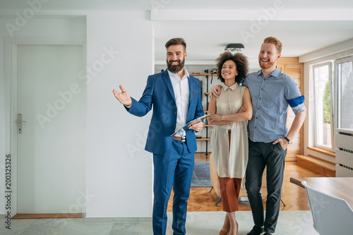 Happy couple moving in a new house.