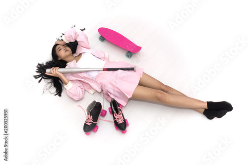 Tablou pe pânză Top view of Asian girl lying down on the floor with many sports equipments