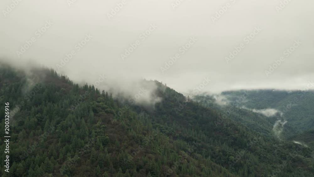 Storm Clouds And Fog Moving Above A Mountain Range Storm Clouds And Fog Moving Above A Mountain Range