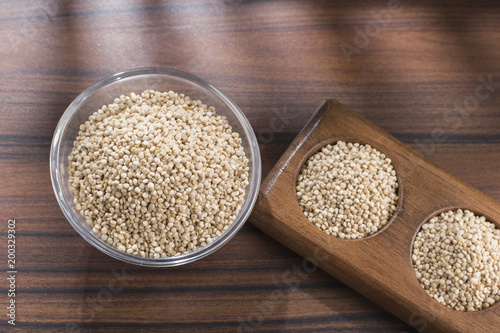 quinoa beans in bowl on wooden background