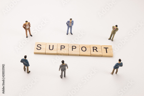 businessman figures meeting on support word