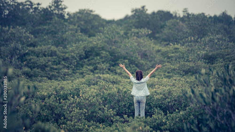 Fototapeta premium Happy women enjoying nature. Outstretched arms in summer or spring. copy space.