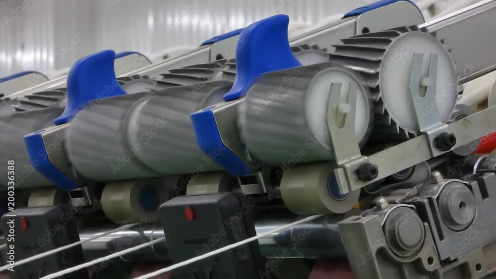Machinery and equipment in the workshop for the production of thread. interior of industrial textile factory. the camera is stationary Machinery and equipment in the workshop for the production of thread. interior of industrial textile factory. the camera is stationary