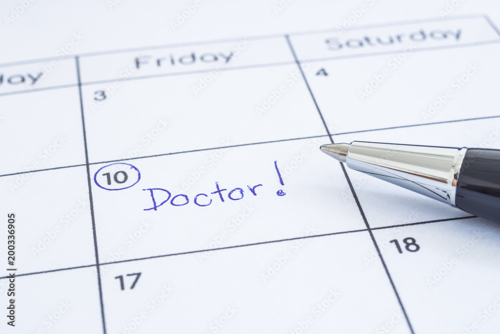 Doctor appointment date writing on calendar. Doctor appointment date writing on calendar.