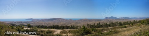 Panoramic view of the mountains and the sea in the summer.