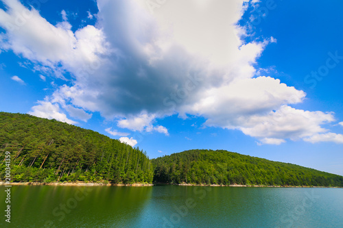 Mountain landscape with lake Gozna surrounded by forest at Valiug  Caras-Severin County  Romania 