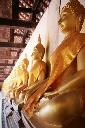 Buddha image god within gold colored in the ayutthaya historical park Thailand 