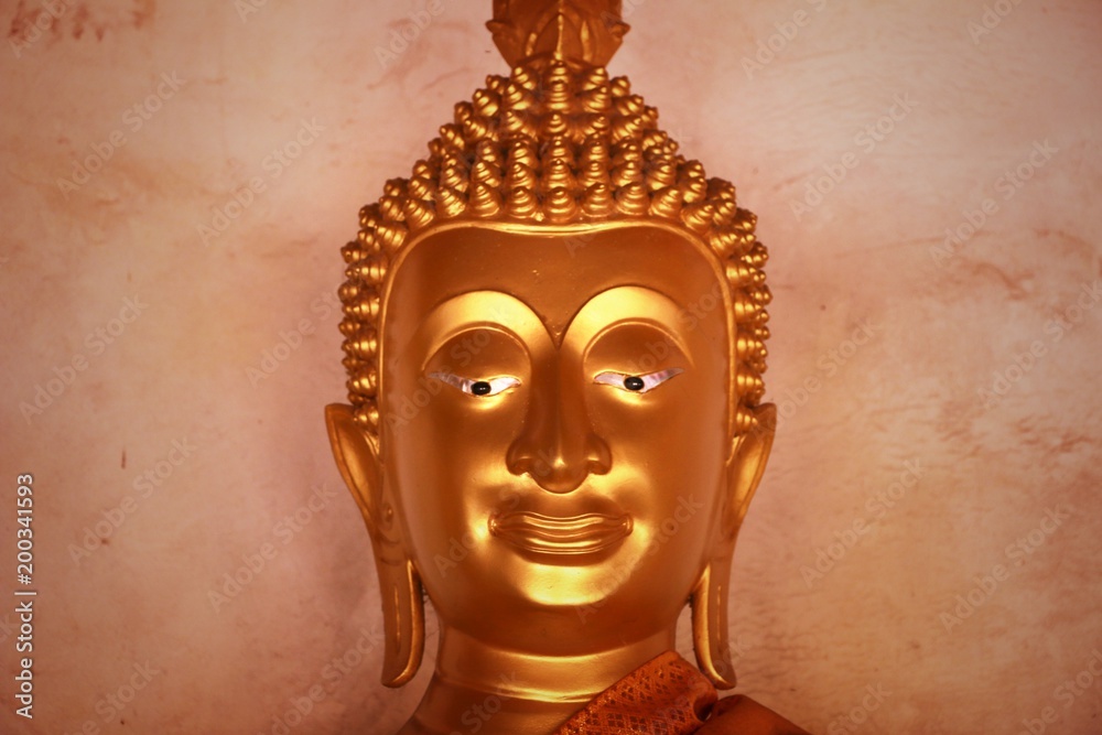 Buddha image god within gold colored in the ayutthaya historical park Thailand