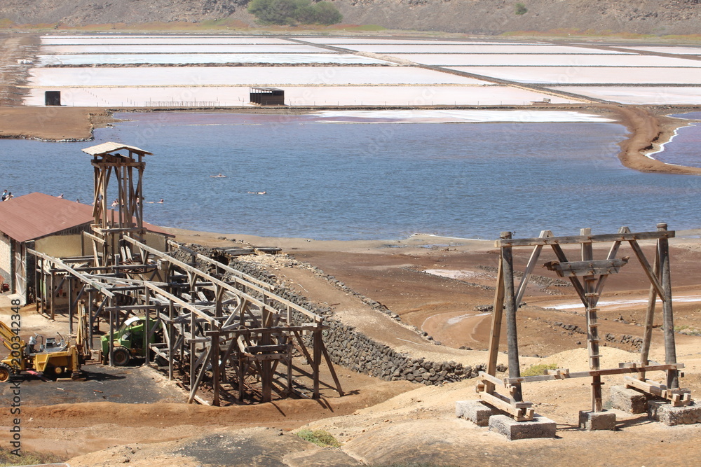 Cape Verde salt pans, base infrastucture wood pylon; salt pans dried and a tourist salt swimming bath Cape Verde salt pans, base infrastucture wood pylon; salt pans dried and a tourist salt swimming bath
