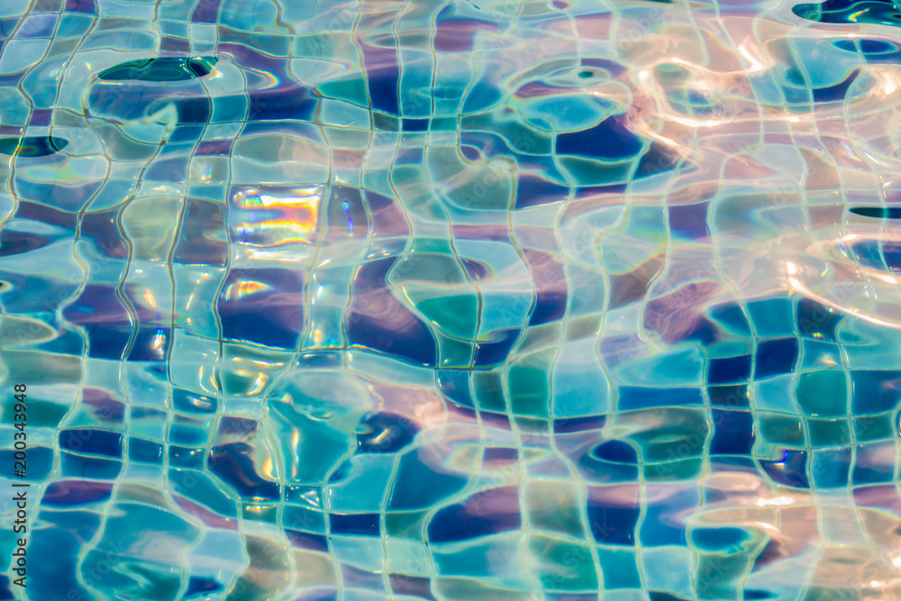 Blue pool water with sun reflections Blue pool water with sun reflections