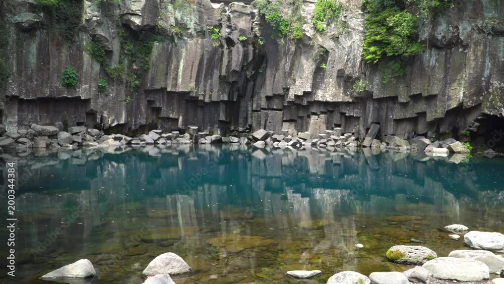 Cheonjeyeon 1st waterfall. Cheonjeyeon is a three-tier waterfall, which is one of the most famous falls in Jeju island, Korea. At the first waterfall, water falls only when it rains. Cheonjeyeon 1st waterfall. Cheonjeyeon is a three-tier waterfall, which is one of the most famous falls in Jeju island, Korea. At the first waterfall, water falls only when it rains.