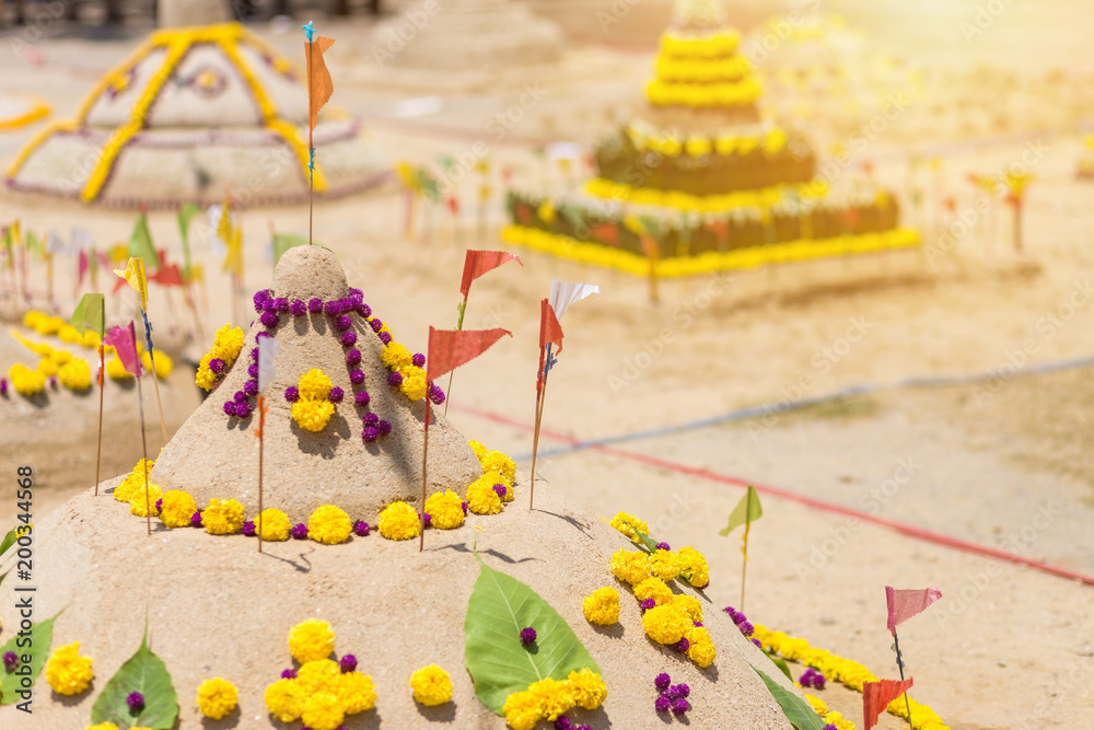 Fototapeta premium Thai people come to build the Sand Pagoda for return the sand to the temple on Songran festival at Ratchaburana temple in Phitsanulok Thailand.