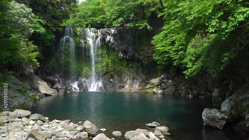 Cheonjeyeon 2nd waterfall. Cheonjeyeon is a three-tier waterfall, which is one of the most famous falls in Jeju island, Korea. The forest around the falls was designated as a Natural Monument No.378.