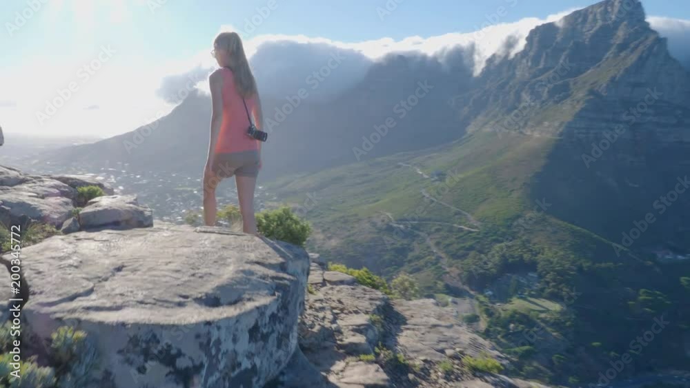 Young woman taking in view of mountains around Cape Town South Africa Young woman taking in view of mountains around Cape Town South Africa