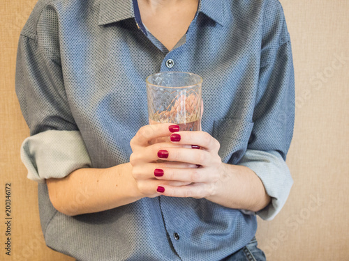 young woman with a glass of water