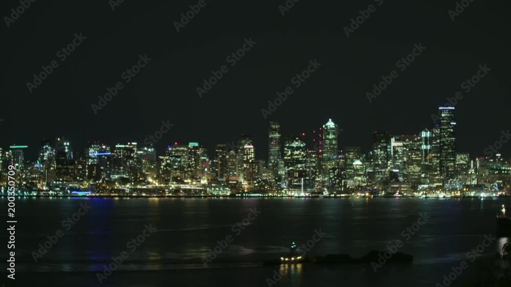 Tugboat Moving Goods Towards Port of Seattle Puget Sound at Night Tugboat Moving Goods Towards Port of Seattle Puget Sound at Night