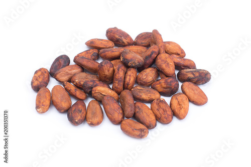 Cocoa beans before roast. Isolated on white background.