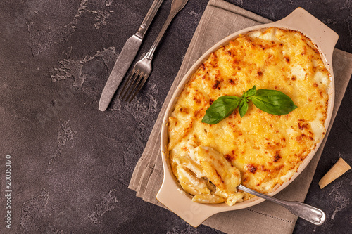 Mac and cheese, american style macaroni pasta in cheesy sauce.