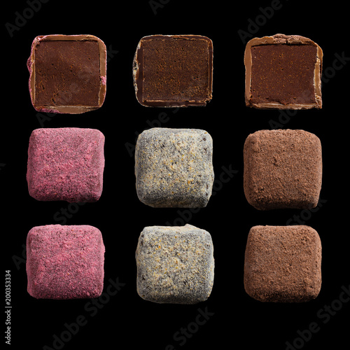 Set of handmade chocolate truffles isolated on black background