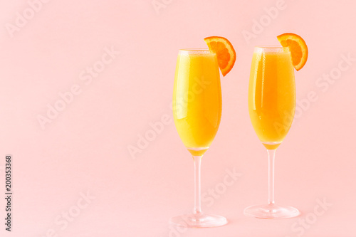 Yellow cocktail on a bright background.
