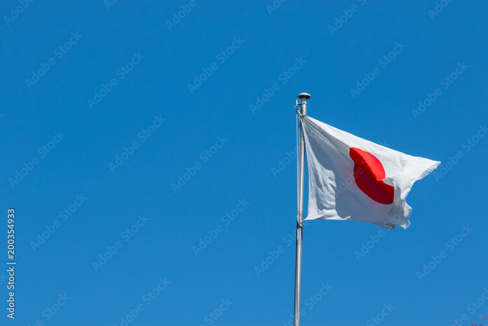 Japan flag waving with blue sky Japan flag waving with blue sky