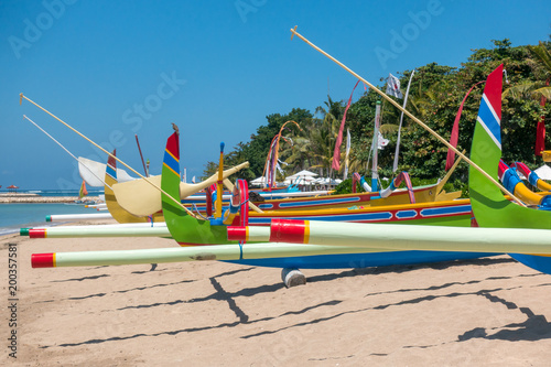 Traditional colorful fishing boats on the beach on Bali, Indonesia photo