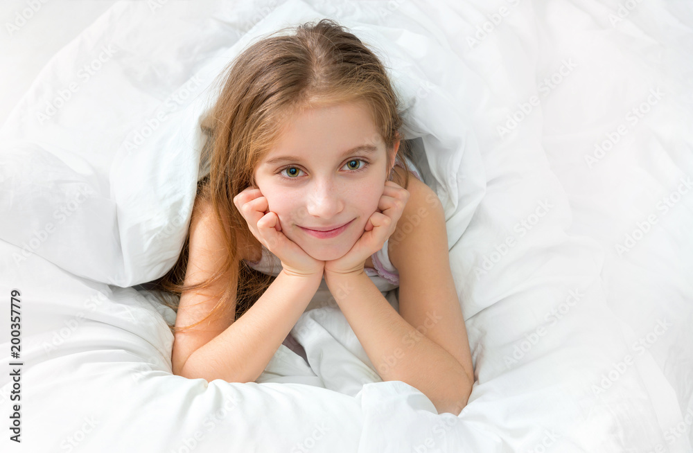 child wrapped with a white blanket, awake child wrapped with a white blanket, awake