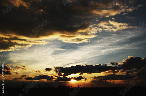 Sunset with clouds over the blue sky.