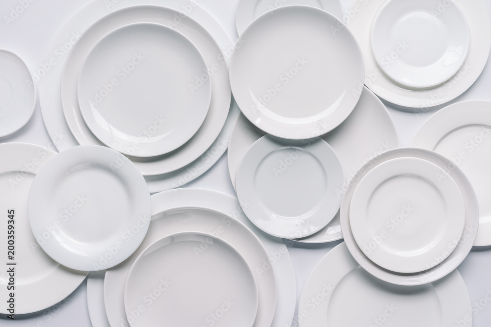 white plates composition on white background white plates composition on white background