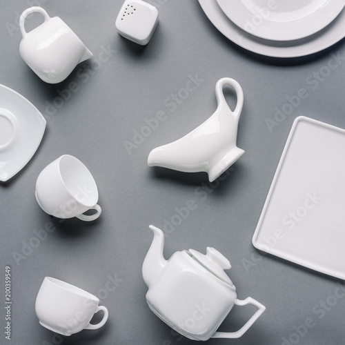 фотографія White china tea-set on grey background
