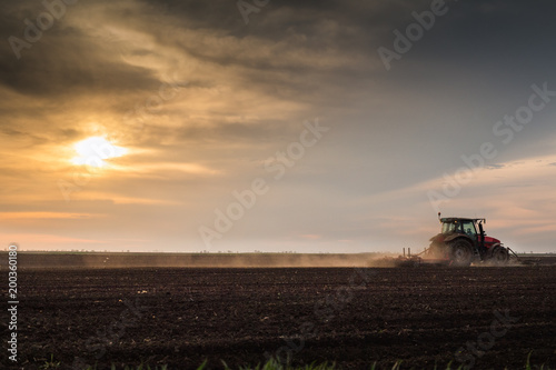 Tractor plowing fields -preparing land for sowing in autumn