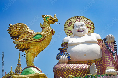 Giant statue of Big Happy Buddha, Wat Plai Laem Temple, Suwannaram Ban Bo Phut, Koh Samui, Thailand photo