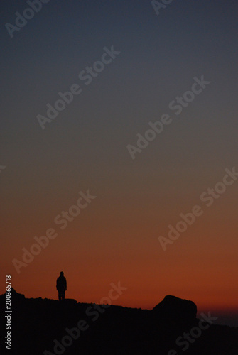 a climber waiting the sunrise                                                 