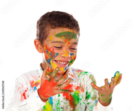 Fototapeta Naklejka Na Ścianę i Meble -  Funny boy with hands and face full of paint