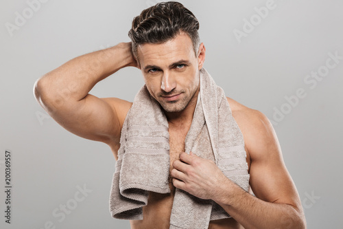 Handsome mature man holding towel. photo