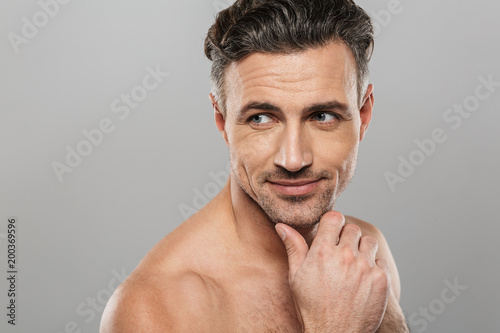 Handsome cheerful mature man. Looking aside.