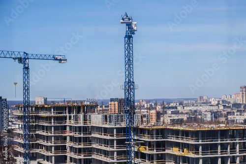 tower cranes against the bl...