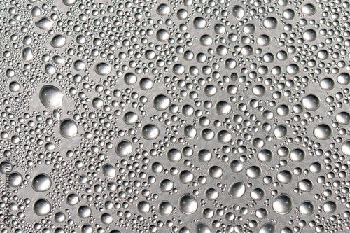 Good background made of a closeup of water droplets on the shiny surface.