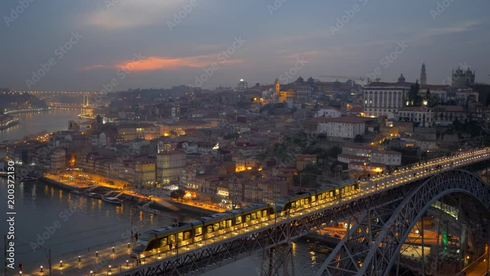 Trains of the Porto Metro meets on Dom Luis I Bridge. Night shot after sunset of Porto, Portugal. Trains of the Porto Metro meets on Dom Luis I Bridge. Night shot after sunset of Porto, Portugal.