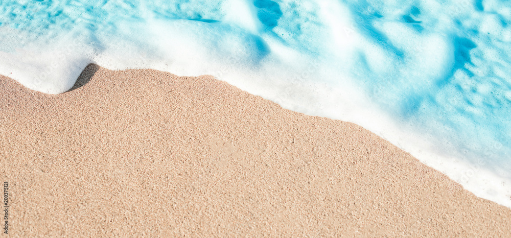 Soft Wave of Blue ocean in summer. Sandy Sea Beach  Background with copy space for text..