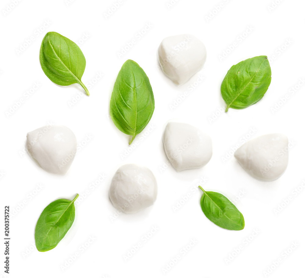 Obraz premium Mozzarella cheese and basil leaf isolated on white background. Top view.